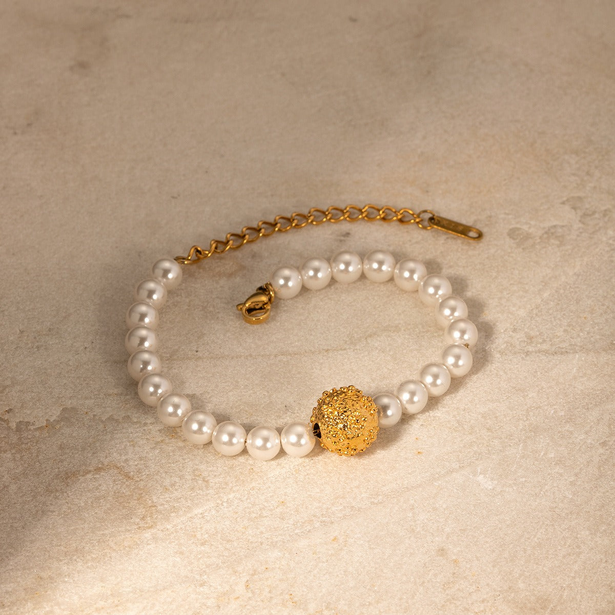 18k gold noble and majestic hammered embossed flower and pearl design bracelet